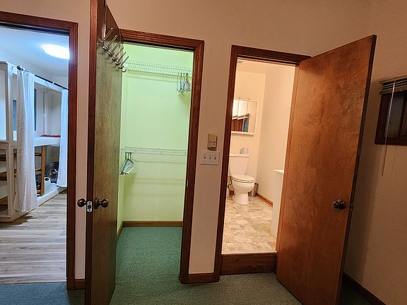 From the main room you access the bathroom, walk-in closet and hallway towards the kitchen.