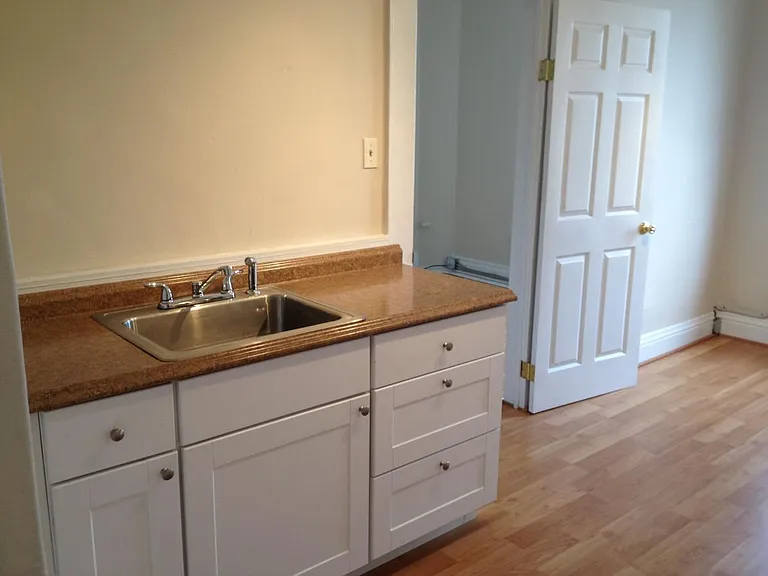 Kitchen w/view into bedroom