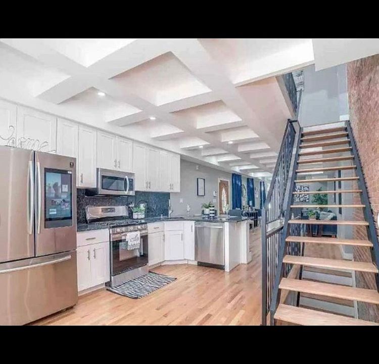Common Space Kitchen, stairway up to second floor.