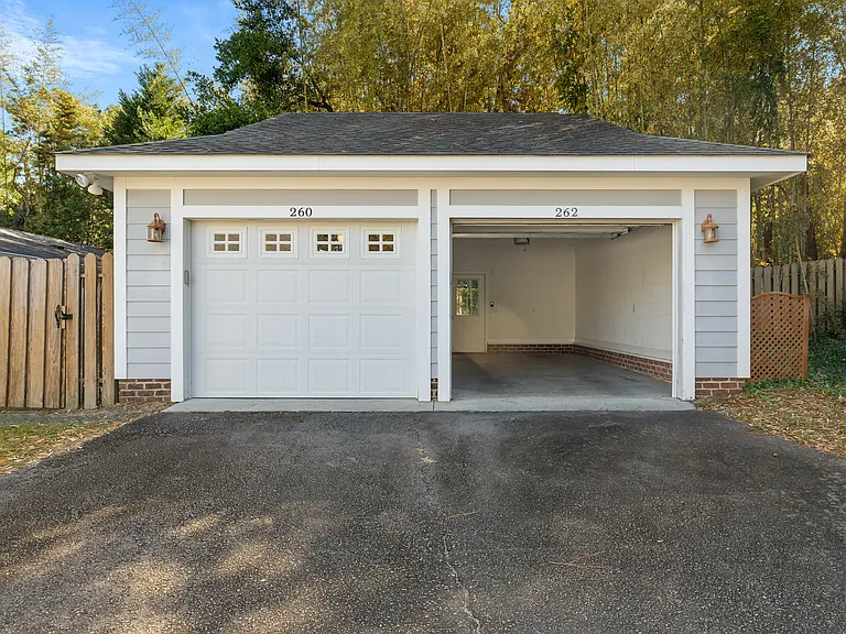 Garage; access is driveway behind neighboring townhomes
