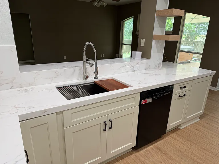 Can look into living room and yard while cooking or doing dishes. A nice space in which to spend time.