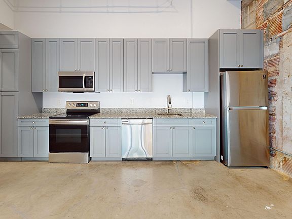 Experience modern living in this stylish kitchen, designed for both functionality and elegance.