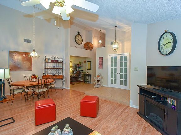 14x10 Dining - Left to right in the photo: Dining, opening to Den with niche above for featuring treasures, hallway to the right has closets and sliding glass doors open to the room currently being used as an office.