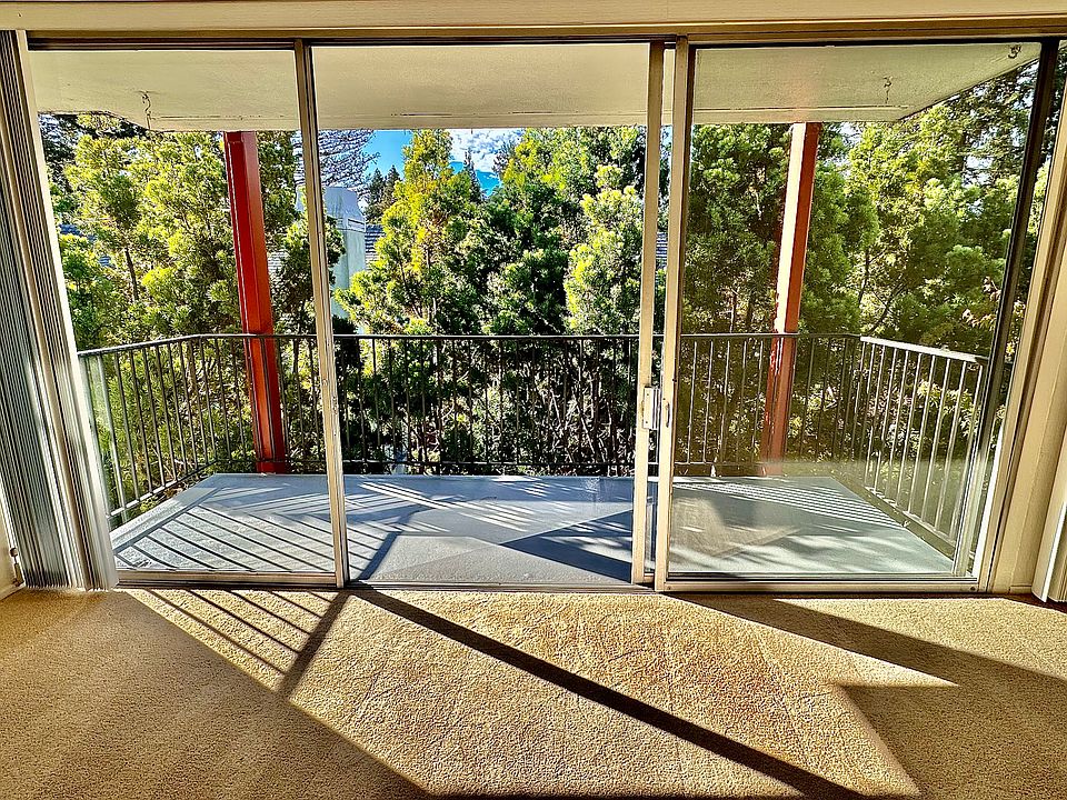Unit #306 living room balcony with incredible tree VIEWS!