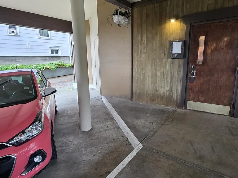 One assigned parking spot, next to secured entry