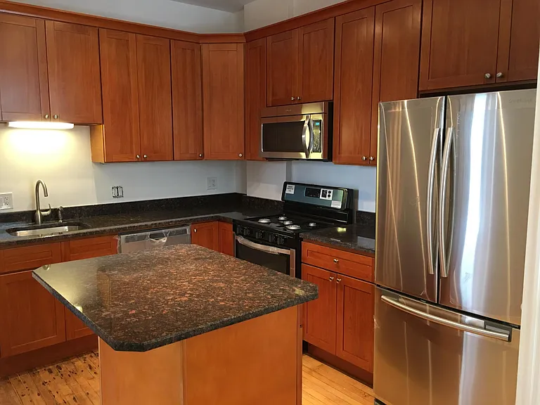 Stainless appliances and seating island