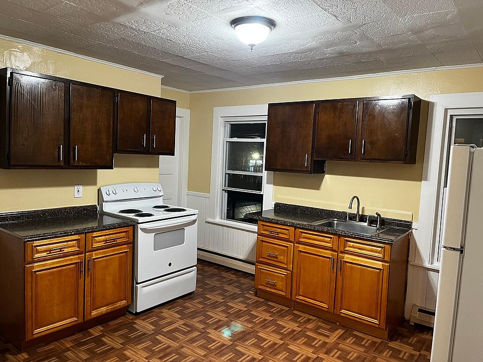 Kitchen with newer refrigerator.