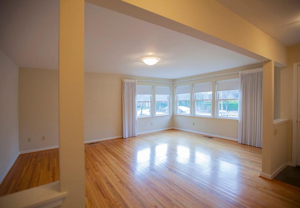 Well lit living room. Oak hardwood floors