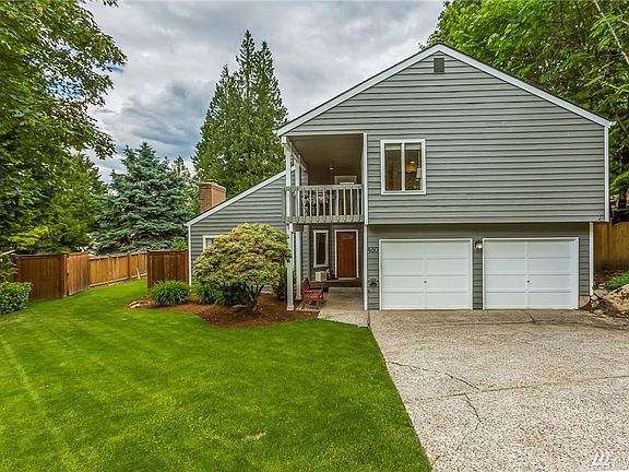 Beautifully maintained lawn and gardens and fresh exterior paint provide wonderful curb-appeal.