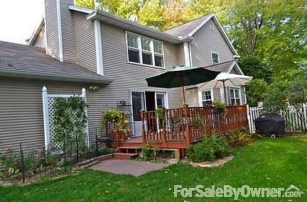 South side of house : Lovely large deck, sm patio leading out to lovely landscaped Zen back yard