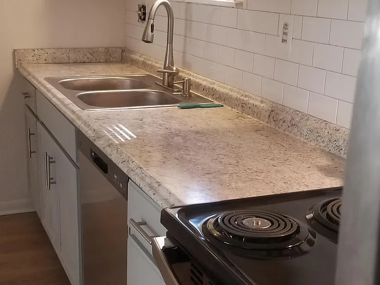 New cabinets, counter tops, sink, and faucet.