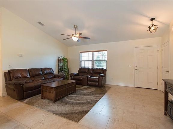 Living room with vaulted ceiling.