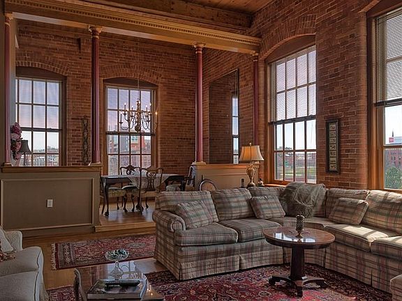 Exposed brick adds charm to this penthouse condo