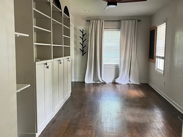 Mixed-use room with built in cabinetry