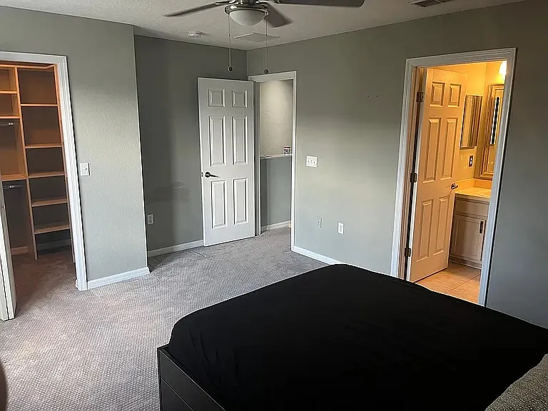 Second bedroom view of closet and bathroom entrances