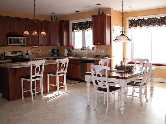 Kitchen with expanded breakfast nook, window seat and stainless appliances