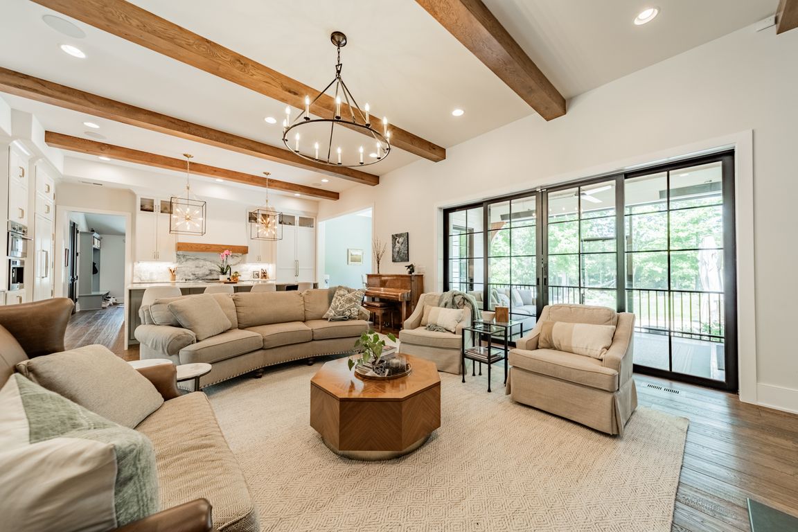 Enjoy your open floorplan and extend your entertain space with eagle style glass doors leading out to the screened porch and expansive patio.