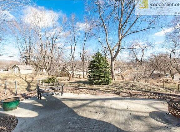 PATIO OVERLOOKING TREED YARD.
