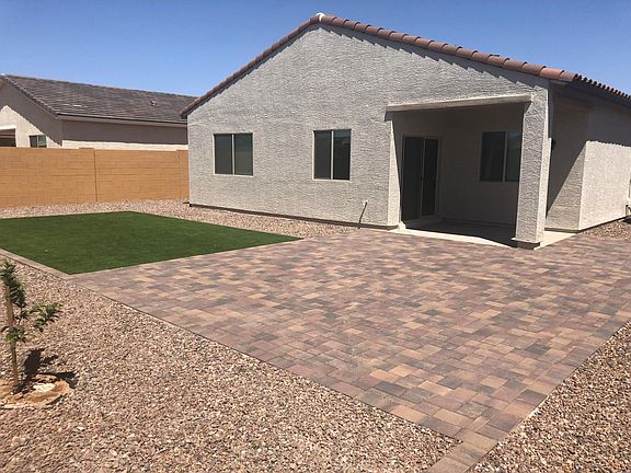 Back view of the home with covered patio - West side