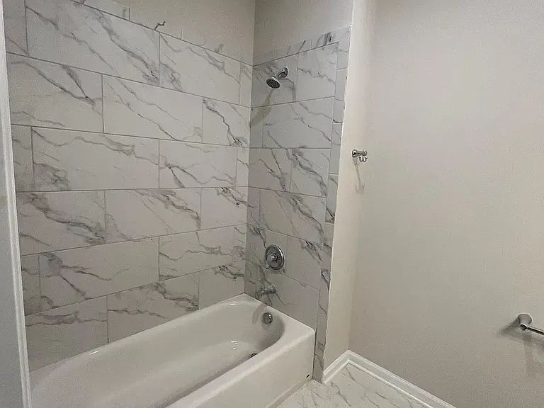 Secondary Bathroom -Luxury Tiled Bath/Shower Combonation in our Two Bedroom and One Bedroom Unit