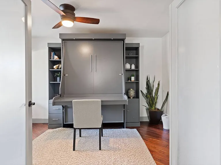 Den/4th bedroom, right off the family room - perfect set up for work space, or can convert into bedroom