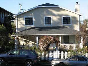 Front has a beautiful garden and large porch 