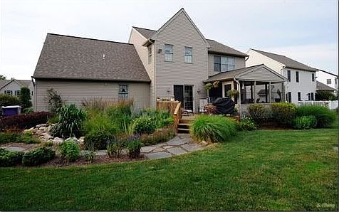 rear yard with award winning KOI pond and screened in porch