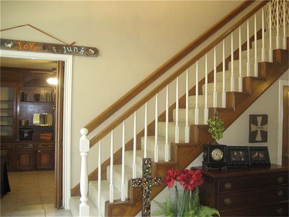 Stairway leads to upstairs with two bedrooms and a jack and jill bath connecting. Study is seen to t