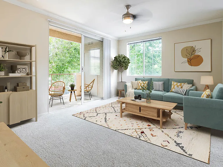 Carpeted Living Room with Balcony