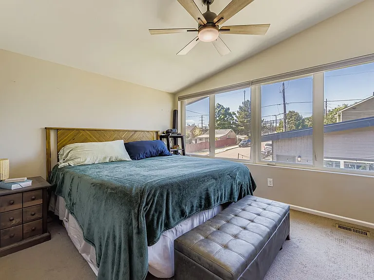 Upstairs primary bedroom with big windows to back yard - fits king-size bed