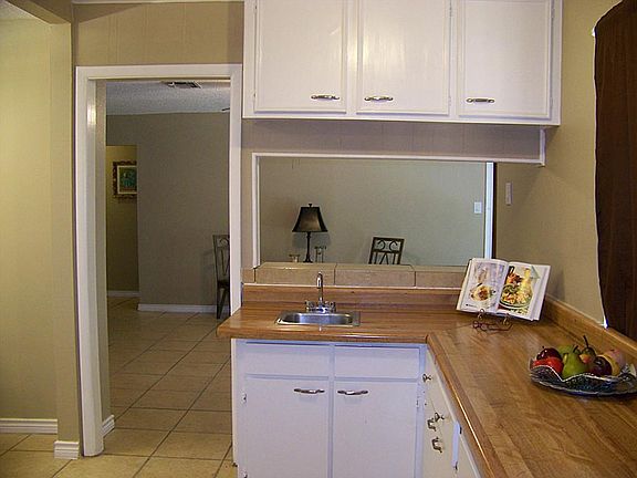 Convenient wet bar facing your den area for easy conversation.