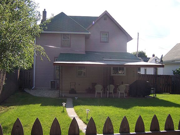 Back yard w/covered patio & beautiful landscape