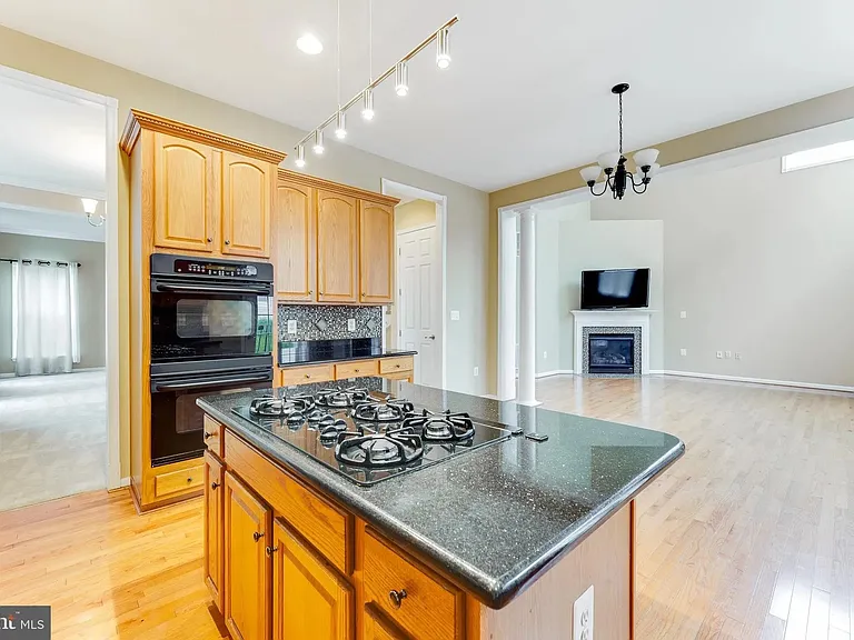 Open Kitchen to breakfast nook and Great Room/ Family room with 19' cathedral ceiling