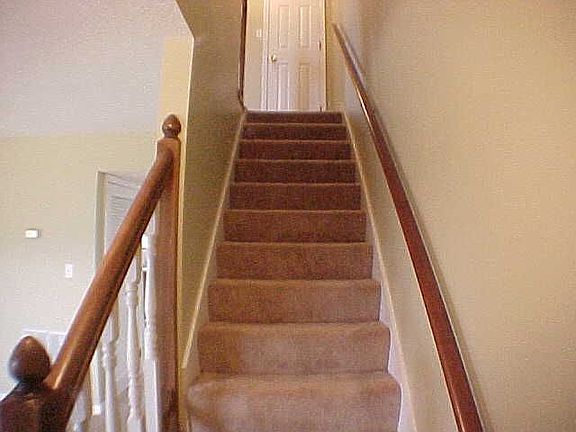 Stairs lead to 2nd level bedrooms and bath