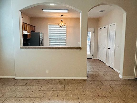 Showcasing entrance to kitchen and breakfast room at the back of the residence
