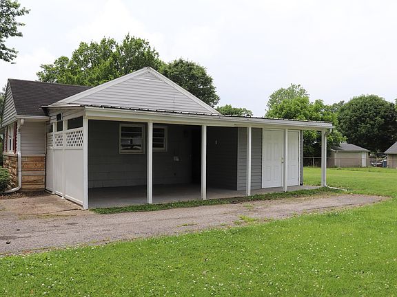 Side of House with Attached Shed