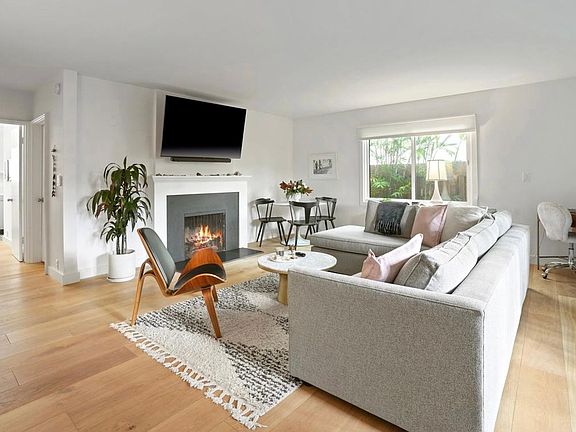 Wall mounted TV. Fireplace is ornamental.