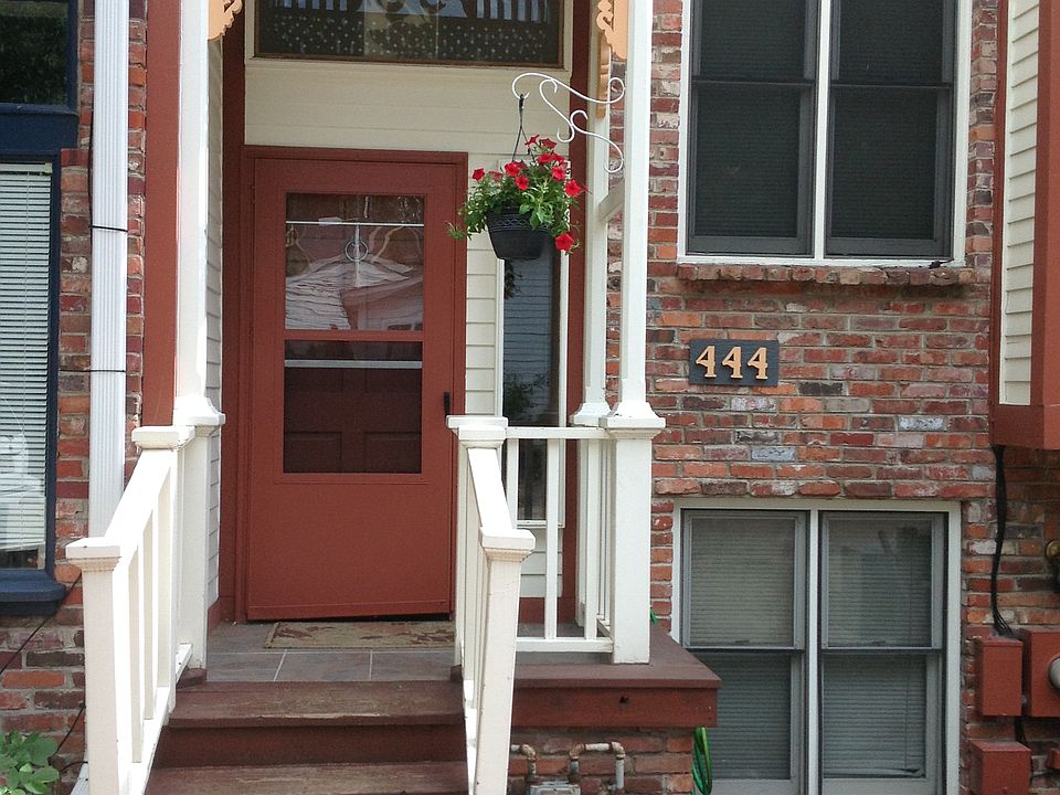 Front door-- with two dedicated parking spots.