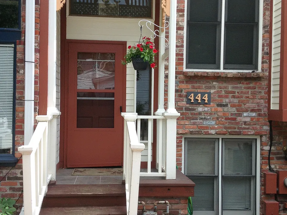 Front door-- with two dedicated parking spots.