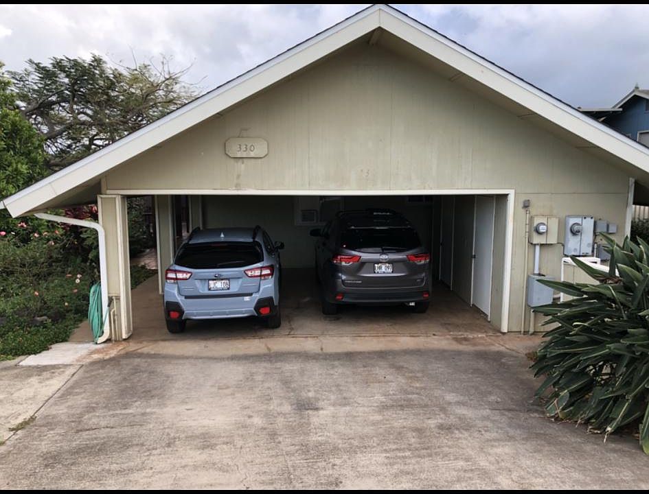 Two car carport with storage as ND laundry room