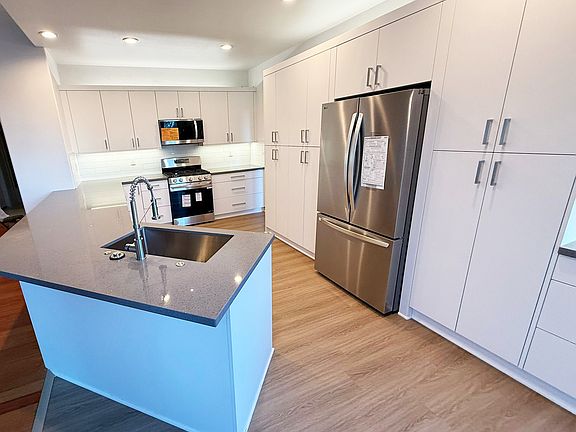 Kitchen
Fully renovated kitchen featuring modern cabinetry, premium countertops, and new appliances