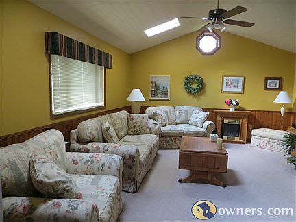Large family room with vaulted ceiling and skylights