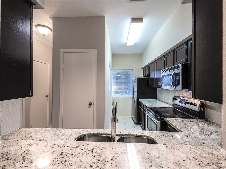 Kitchen with granite countertops and stainless steel appliances