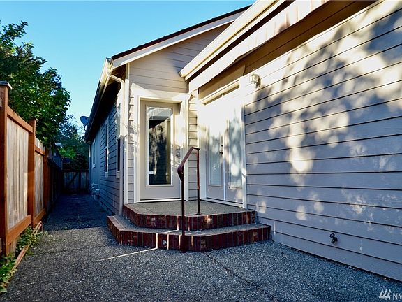 Low maintenance yard with patio awning. 