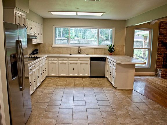 Open Airy Kitchen with stainless steel appliances