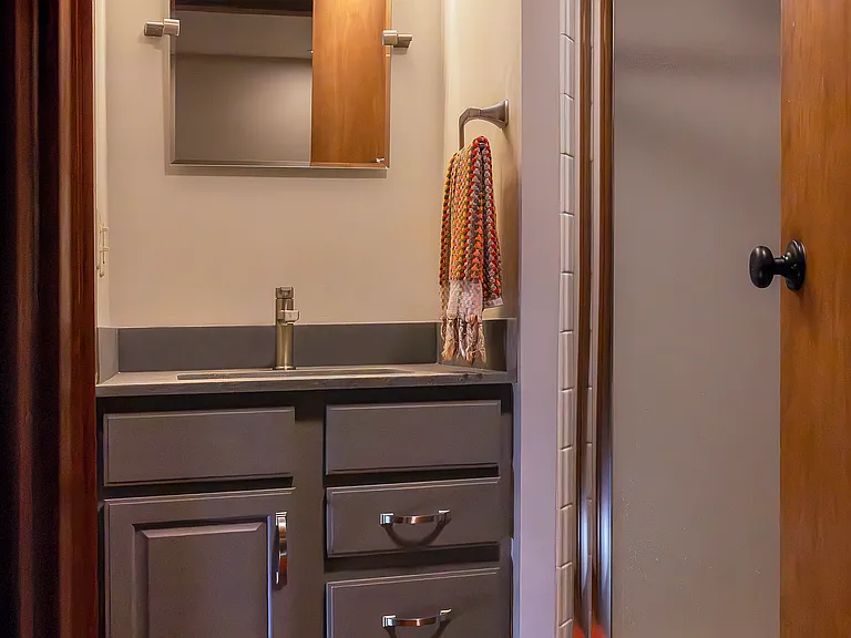 Full bath off two bedroom suite and exercise room