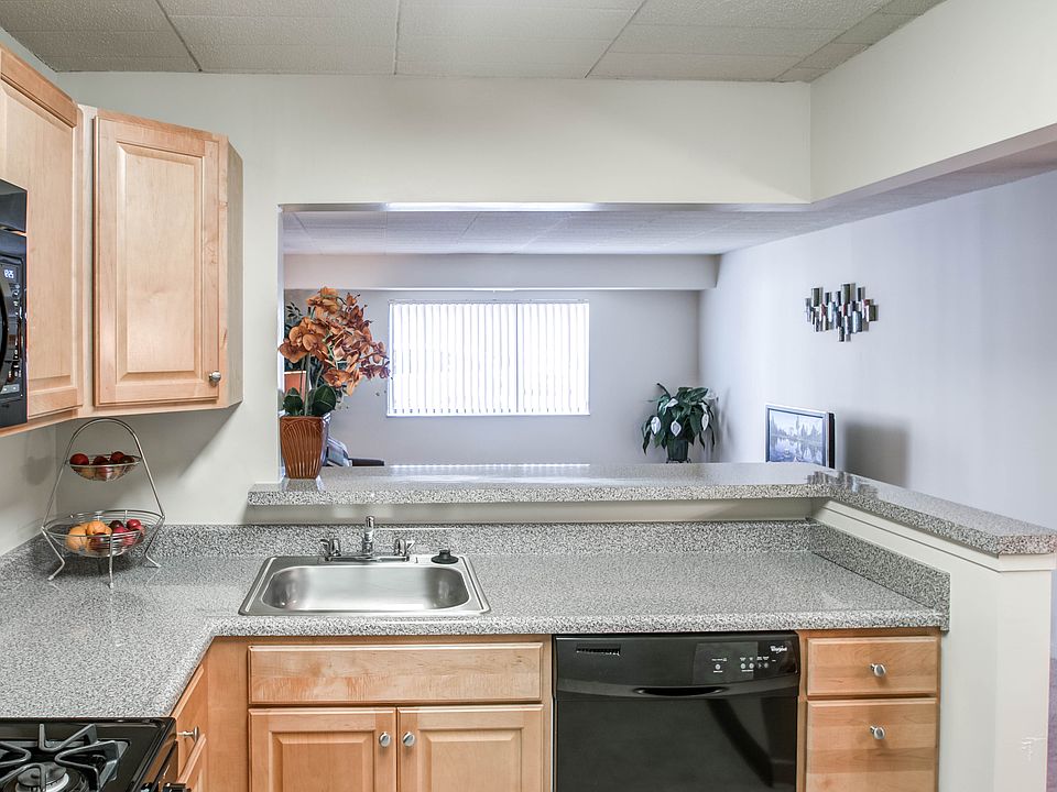Open concept living space with beautifully Upgraded cabinets and countertops in select units