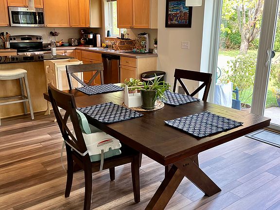 Full Dining Area off Kitchen, with patio doors to rear yard.