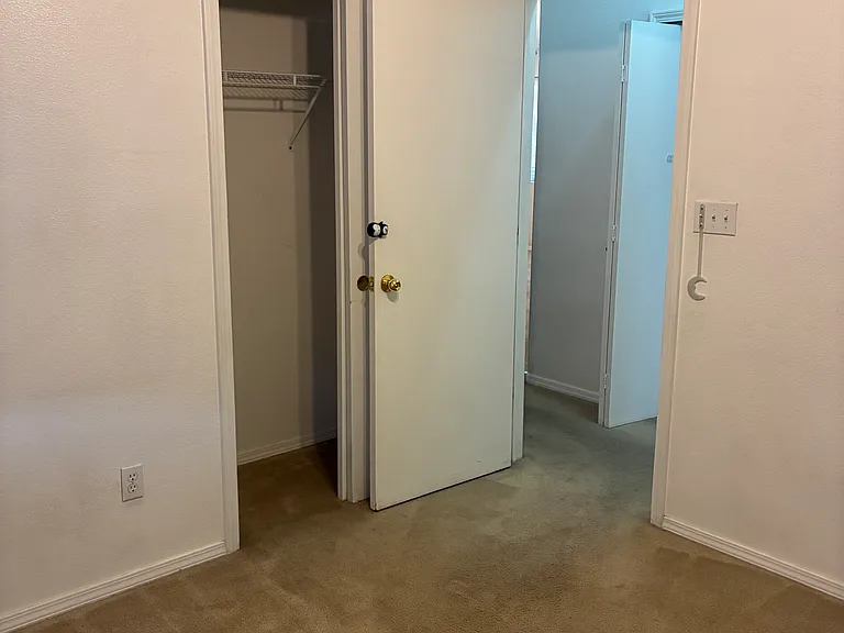 Second bedroom showing entrance to the hall and closet