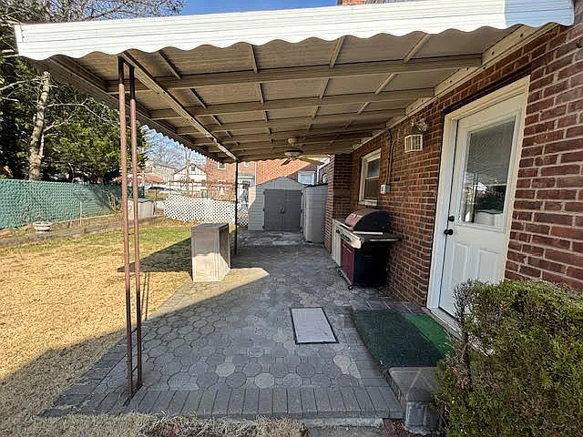 Covered patio and grill.